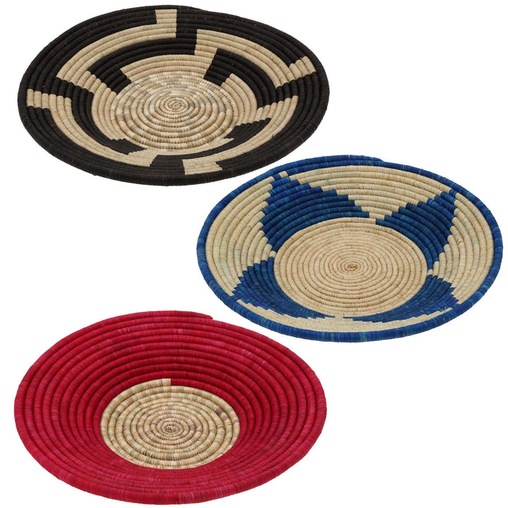 Set of three round woven baskets in red, blue, and black with beige spiral centers