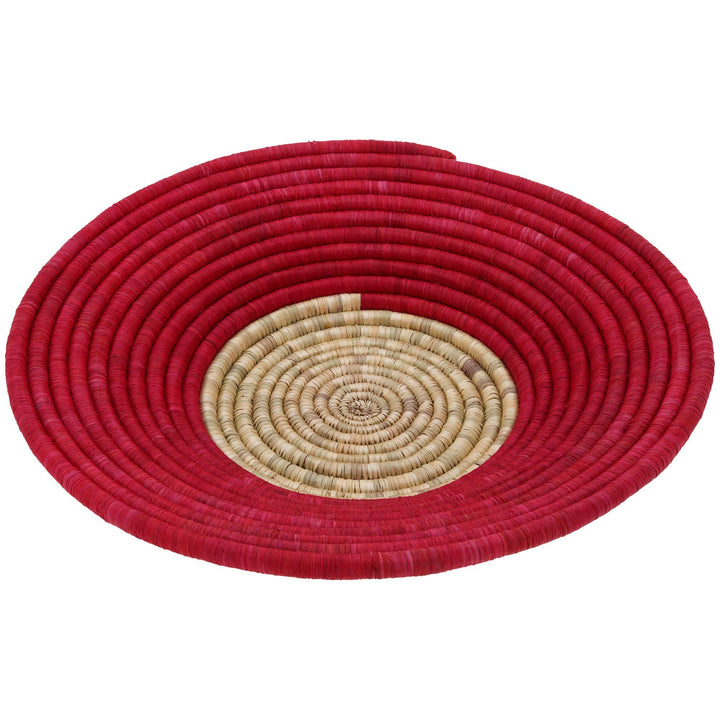 Round woven basket with red outer coil and beige spiral center