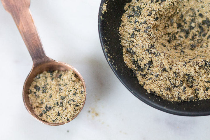 Nigella Caesar seasoning blend in a wooden spoon