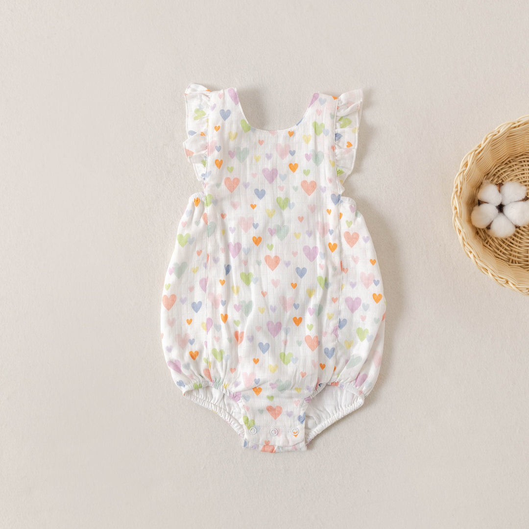Heart-print muslin bubble romper with ruffled shoulders and elastic leg openings