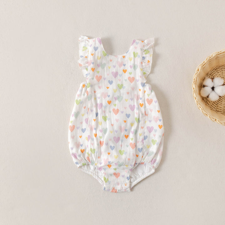 Heart-print muslin bubble romper with ruffled shoulders and elastic leg openings