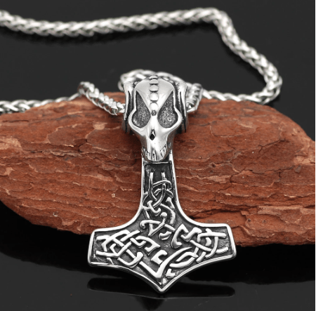 Silver-tone goat skull and Mjolnir pendant on a braided chain necklace