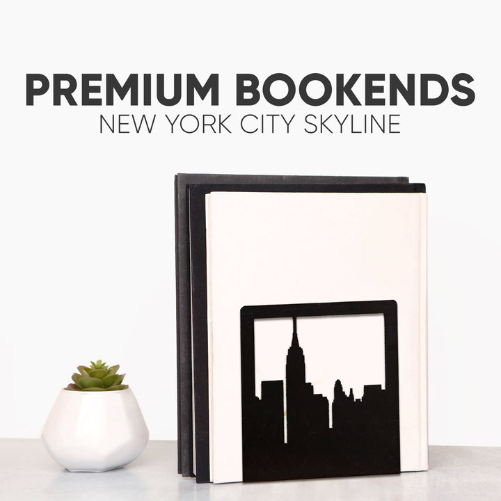 Metal skyline bookend set holding books, black silhouette design on dark base