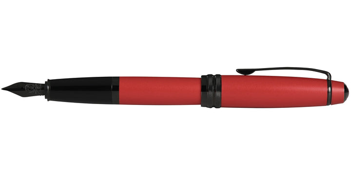 Red matte lacquer fountain pen with black cap end and clip, nib side