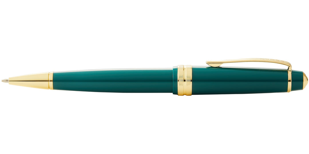 Green resin ballpoint pen with gold-tone clip, tip, and end band