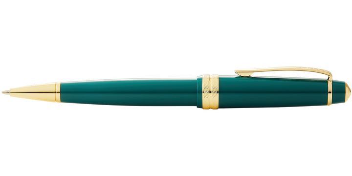 Green resin ballpoint pen with gold-tone clip, tip, and end band