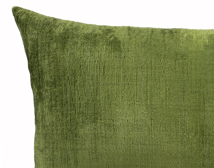 Olive green textured pillow cover close-up with stitched edge detail
