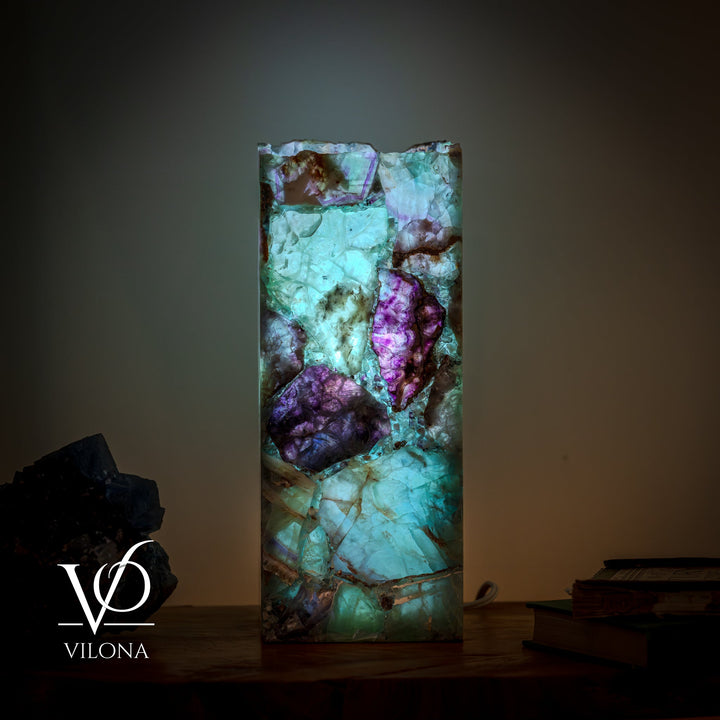 Fluorite table lamp, upright square stone shade in teal and purple faceted pattern.