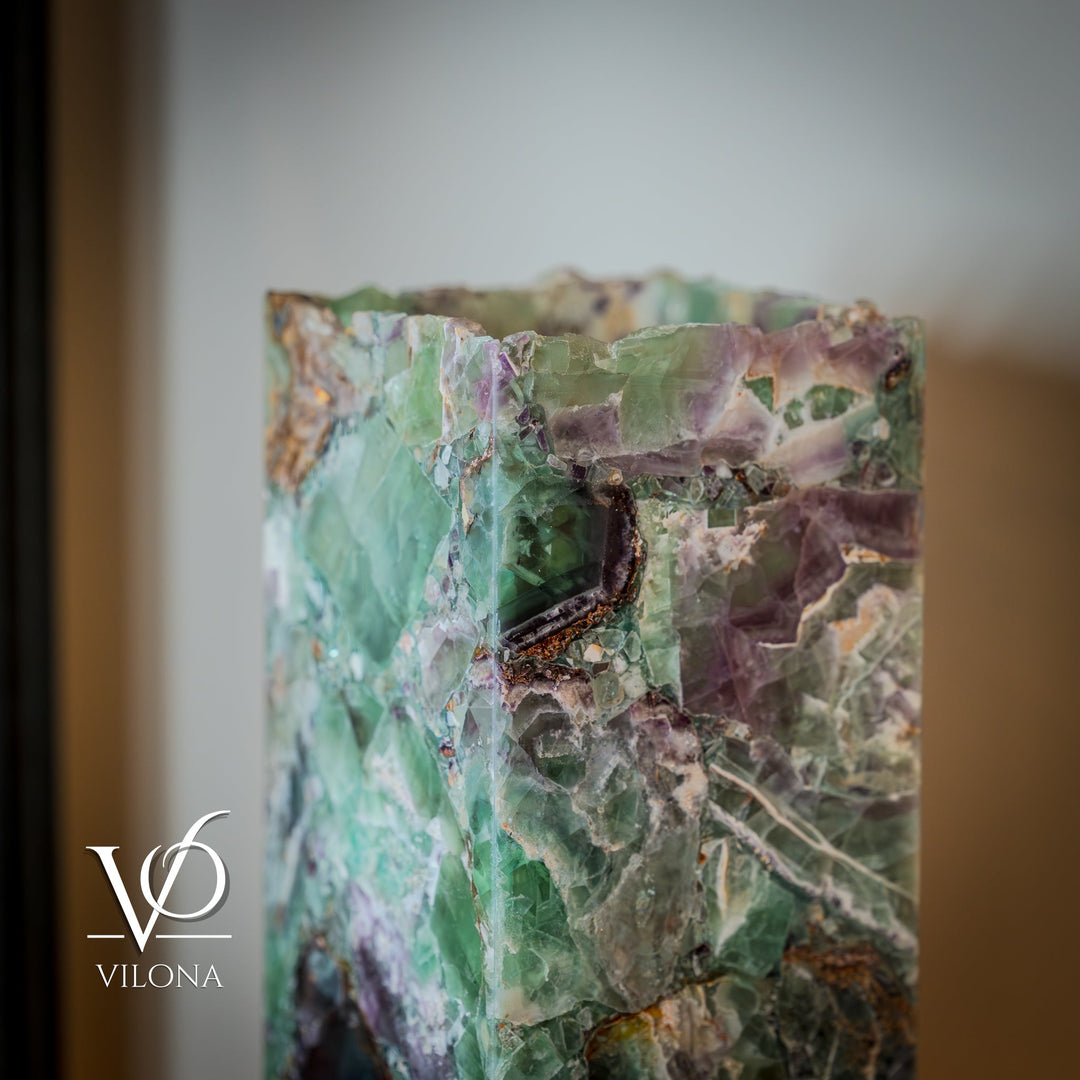 Fluorite table lamp close-up, faceted teal-green and lavender stone panel.