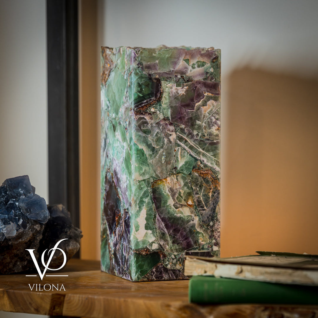 Fluorite table lamp with square live-edge stone shade, mint green and purple patches.