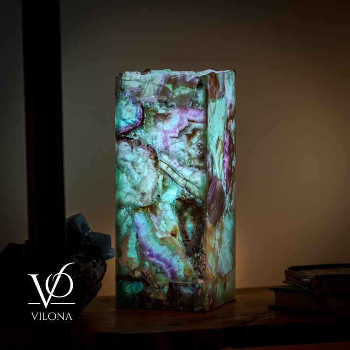 Fluorite table lamp with square live-edge base, teal and purple stone slab finish.