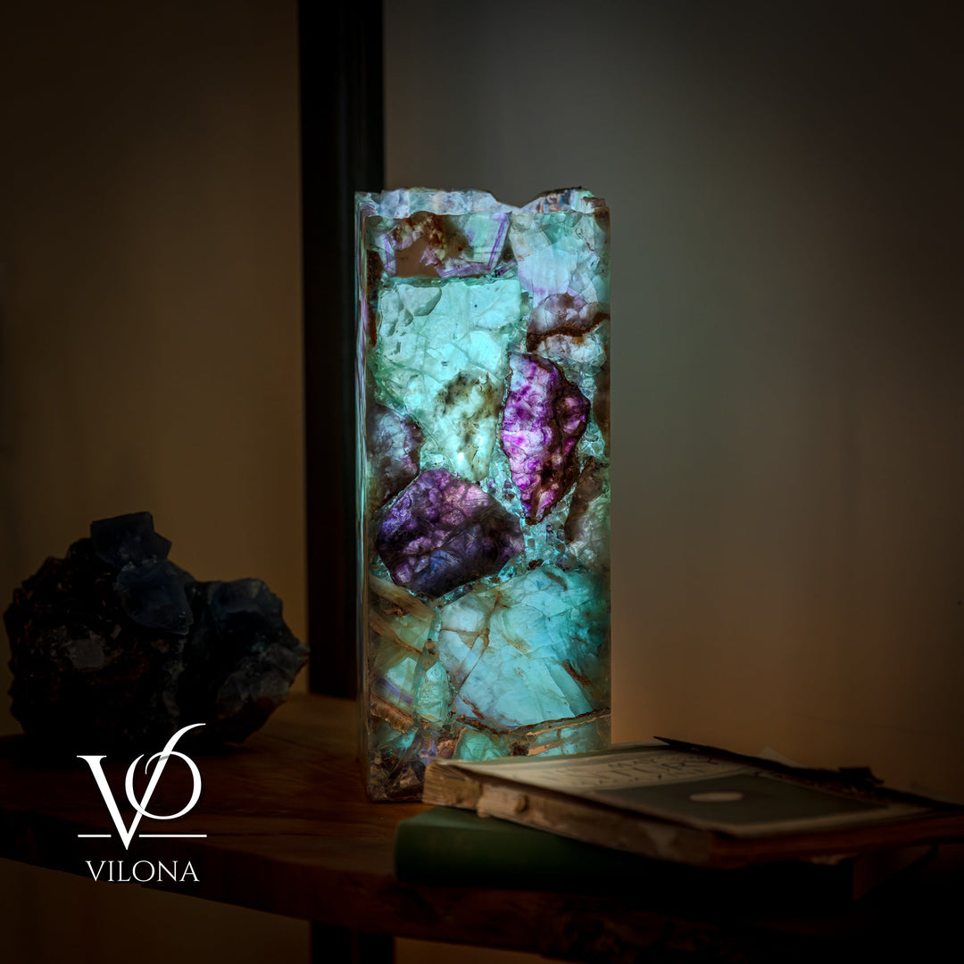 Fluorite table lamp with square crystal shade, teal and purple facets on a dark base