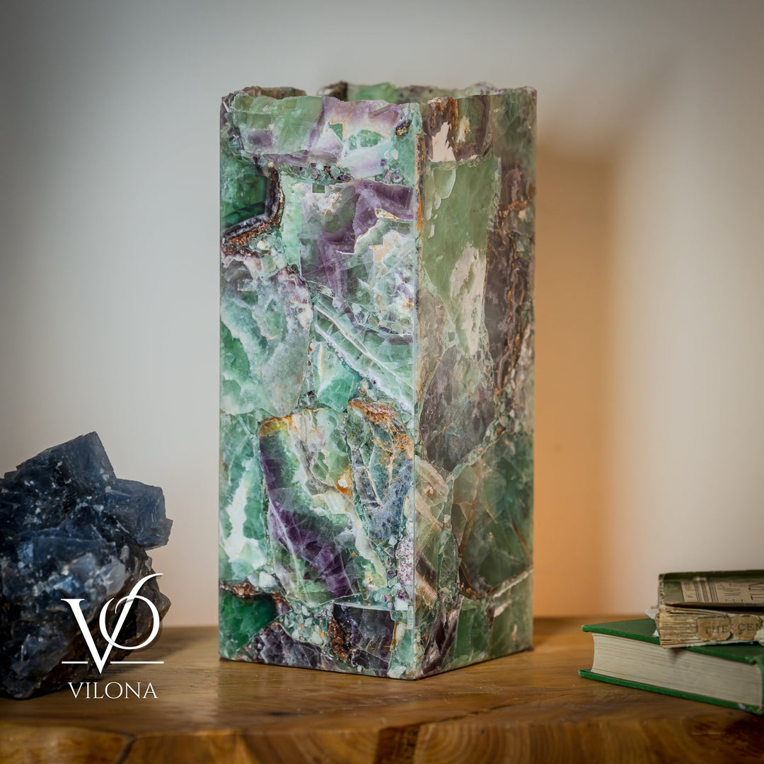 Fluorite table lamp, pale green stone shade with purple and orange mineral striations.