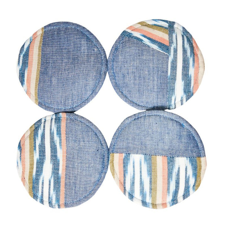 Circular woven coasters, four round blue designs with multicolor stripe and brushstroke accents