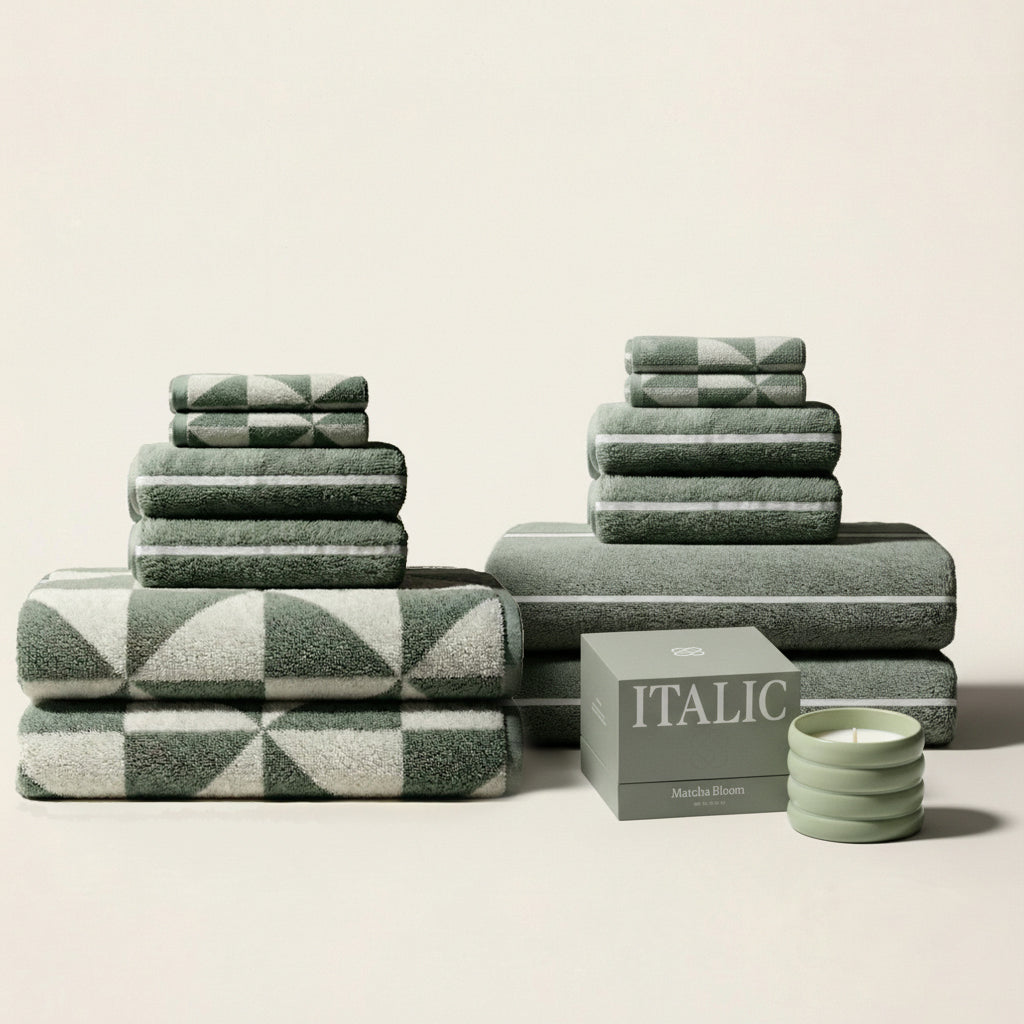 Sage green cotton towel set with ecru plaid-style pattern and striped towels