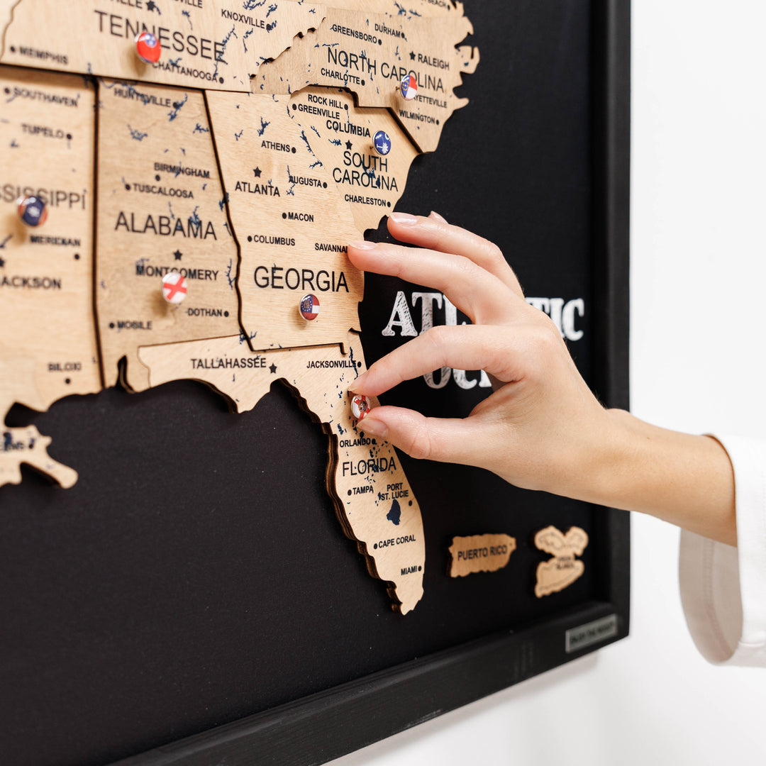 3D wooden USA map detail with raised states and “Georgia” label on black board