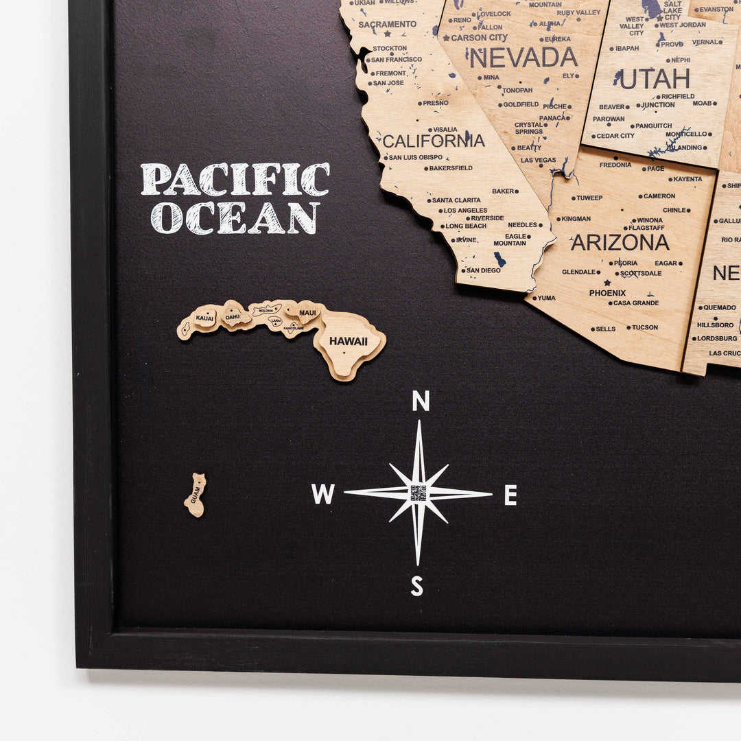 3D wooden USA wall map with “Pacific Ocean” text, compass rose, on black board