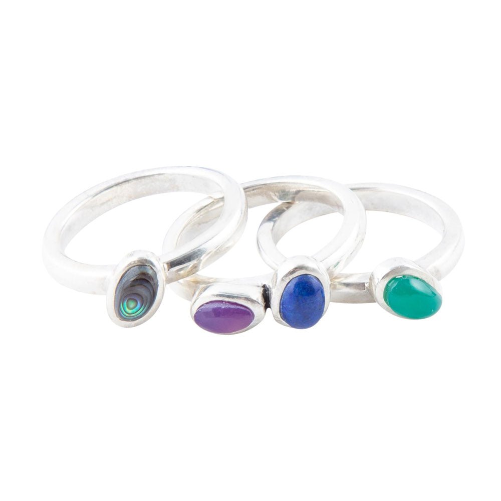 Sterling silver ring set showing three rings with multi-color stones on open bands