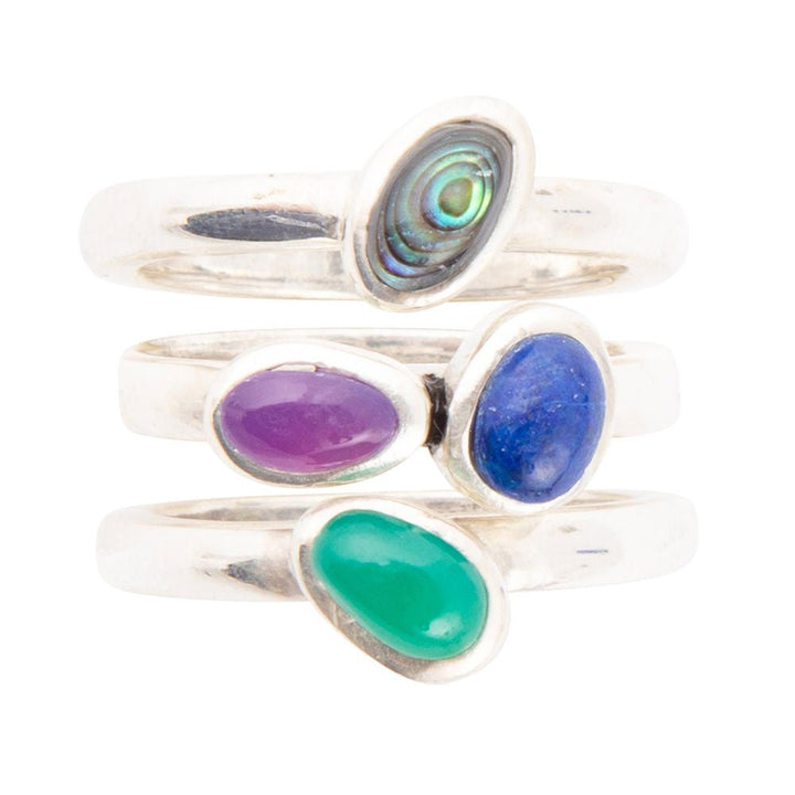Sterling silver ring set detail: green, purple and blue oval stones in silver settings