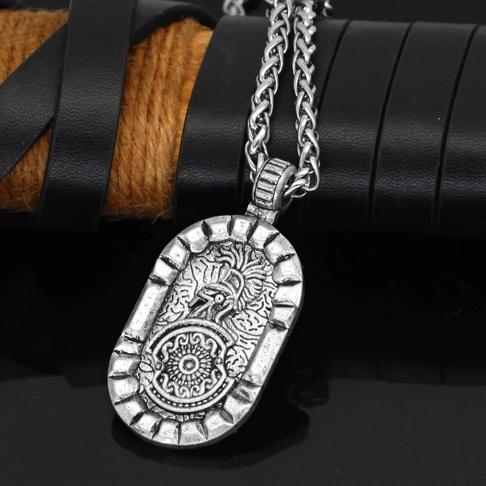 Oval stainless steel lion-and-shield pendant on a twisted chain necklace