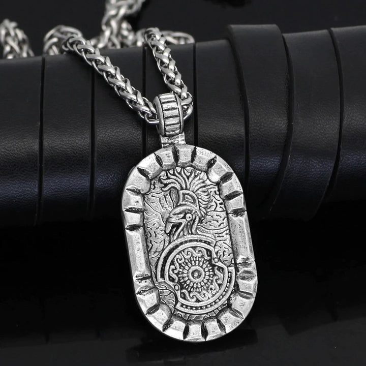Stainless steel oval pendant necklace showing detailed lion, shield, and chain links