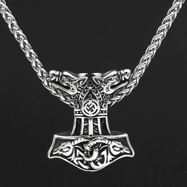 Silver wolf-and-goat-head Mjolnir pendant with chain links, front view
