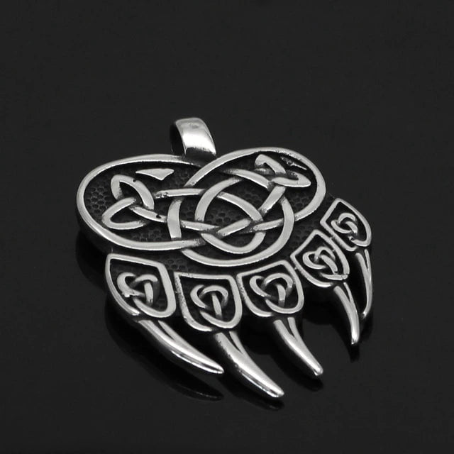 Stainless steel wolf paw pendant with engraved knotwork and three claw points