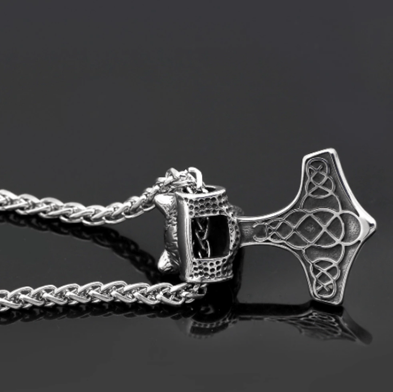 Silver-tone Mjolnir hammer pendant with bear head, side view on chain