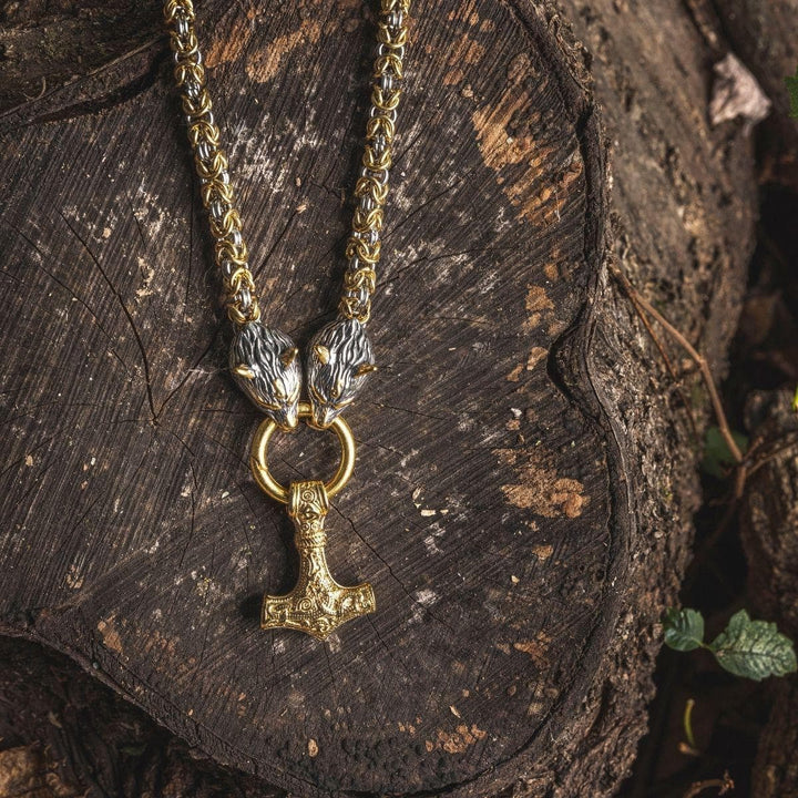 Viking wolf-head Mjolnir pendant necklace with gold-tone links and engraved silver hammer