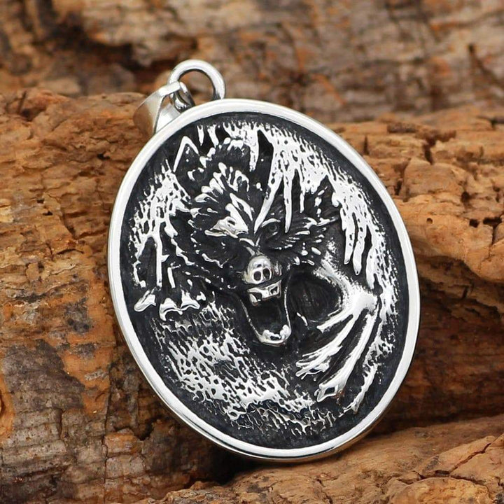 Stainless steel oval wolf pendant with bail and chain, close-up engraved wolf face.