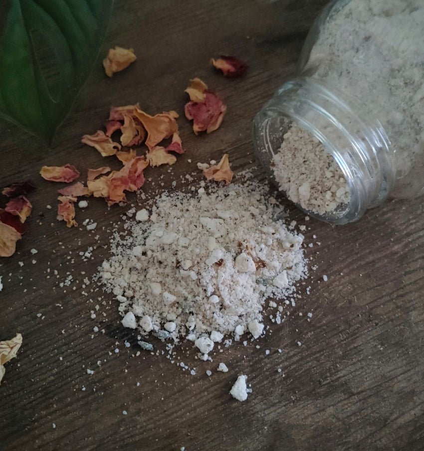 Magnesium bath soak crystals spilled from glass container