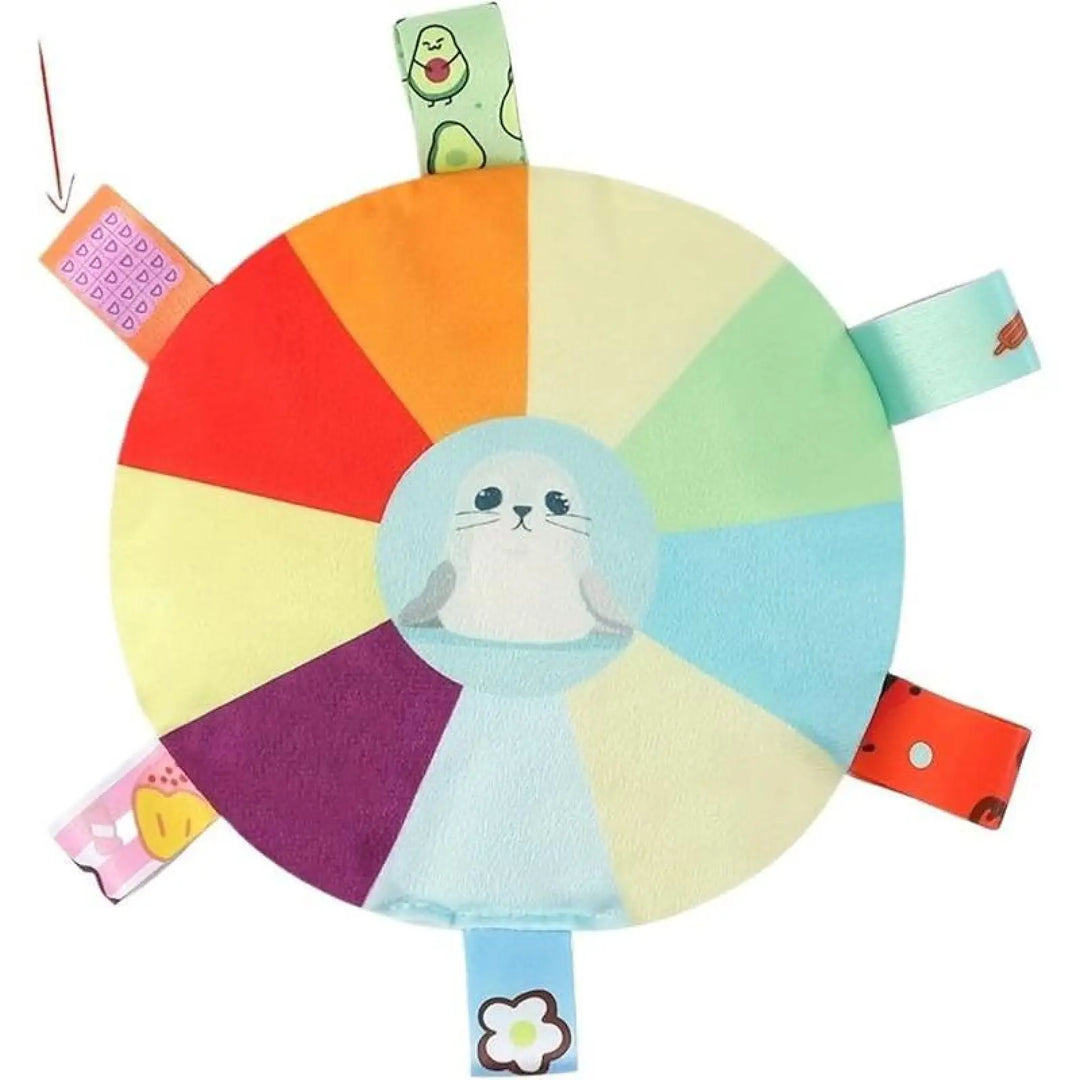 Plush flying disc dog chew toy with light blue animal face and dangling ribbon tags