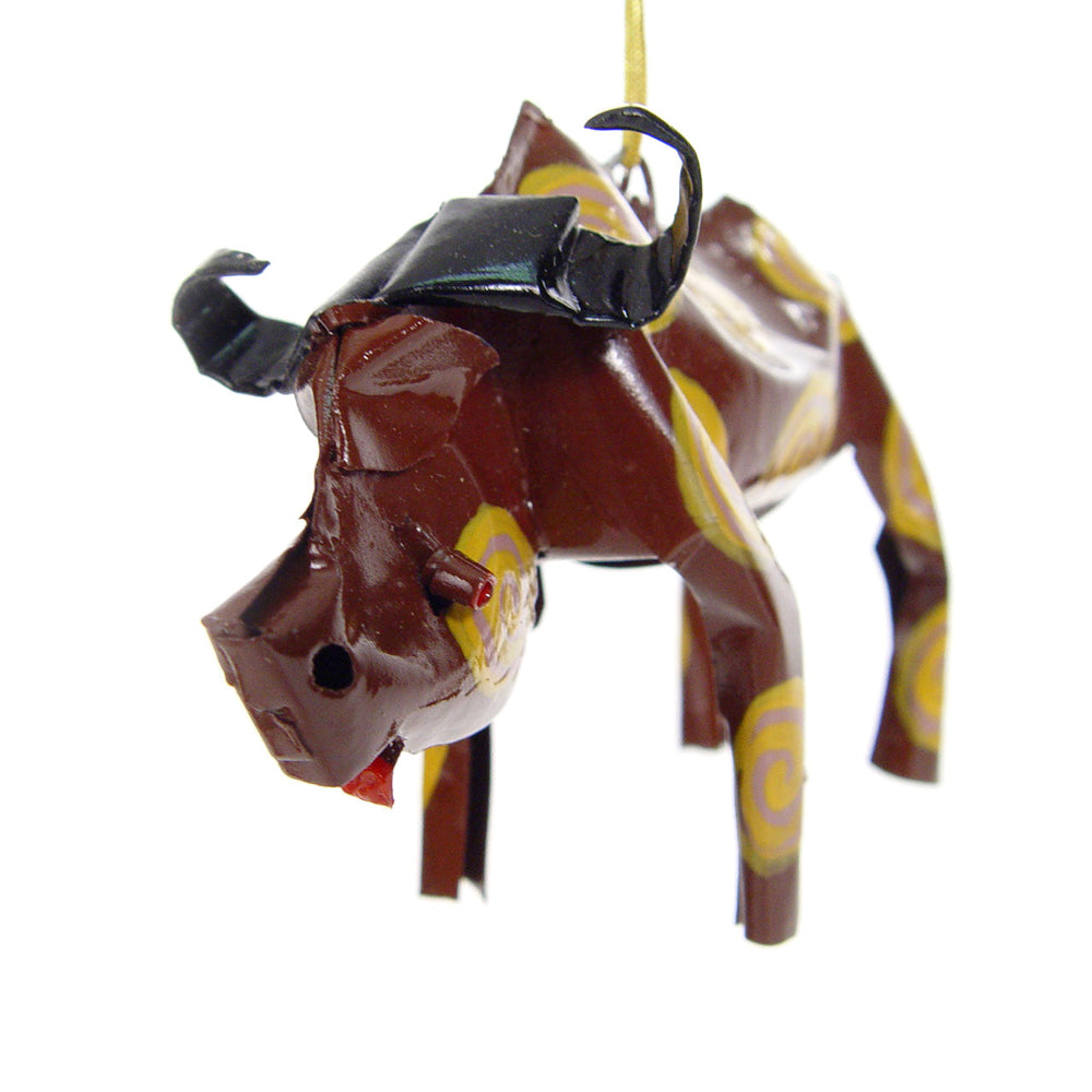 Brown buffalo ornament with black horns and yellow spiral markings, hanging gold cord.