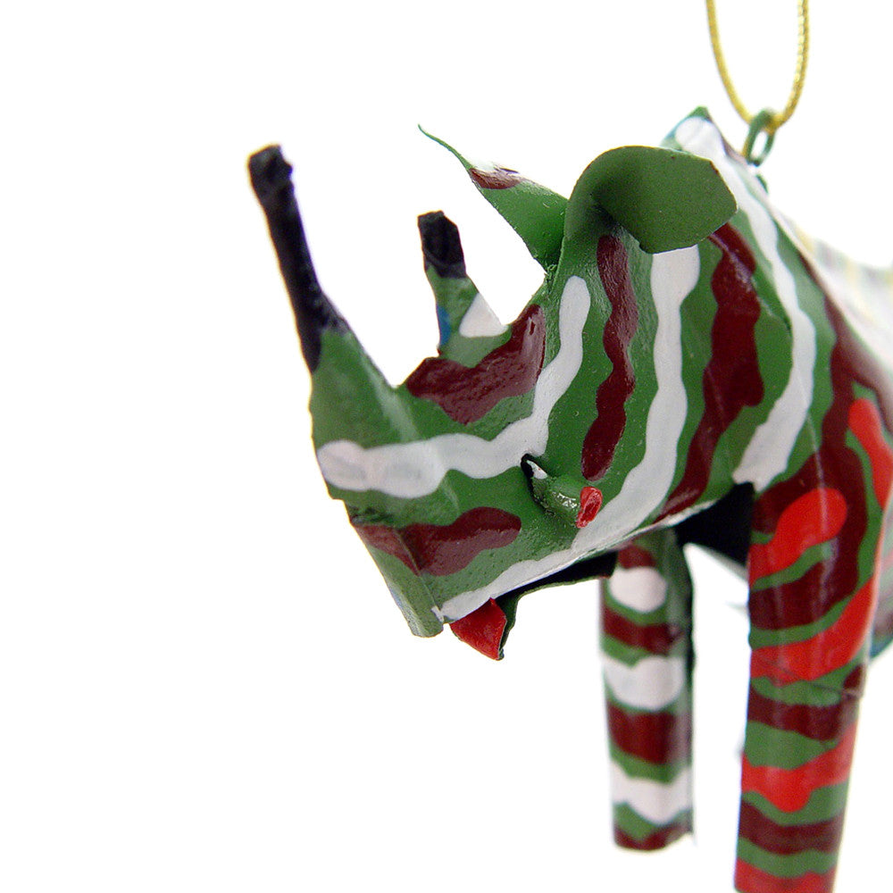Multicolor patterned rhino ornament close-up, hanging from gold loop