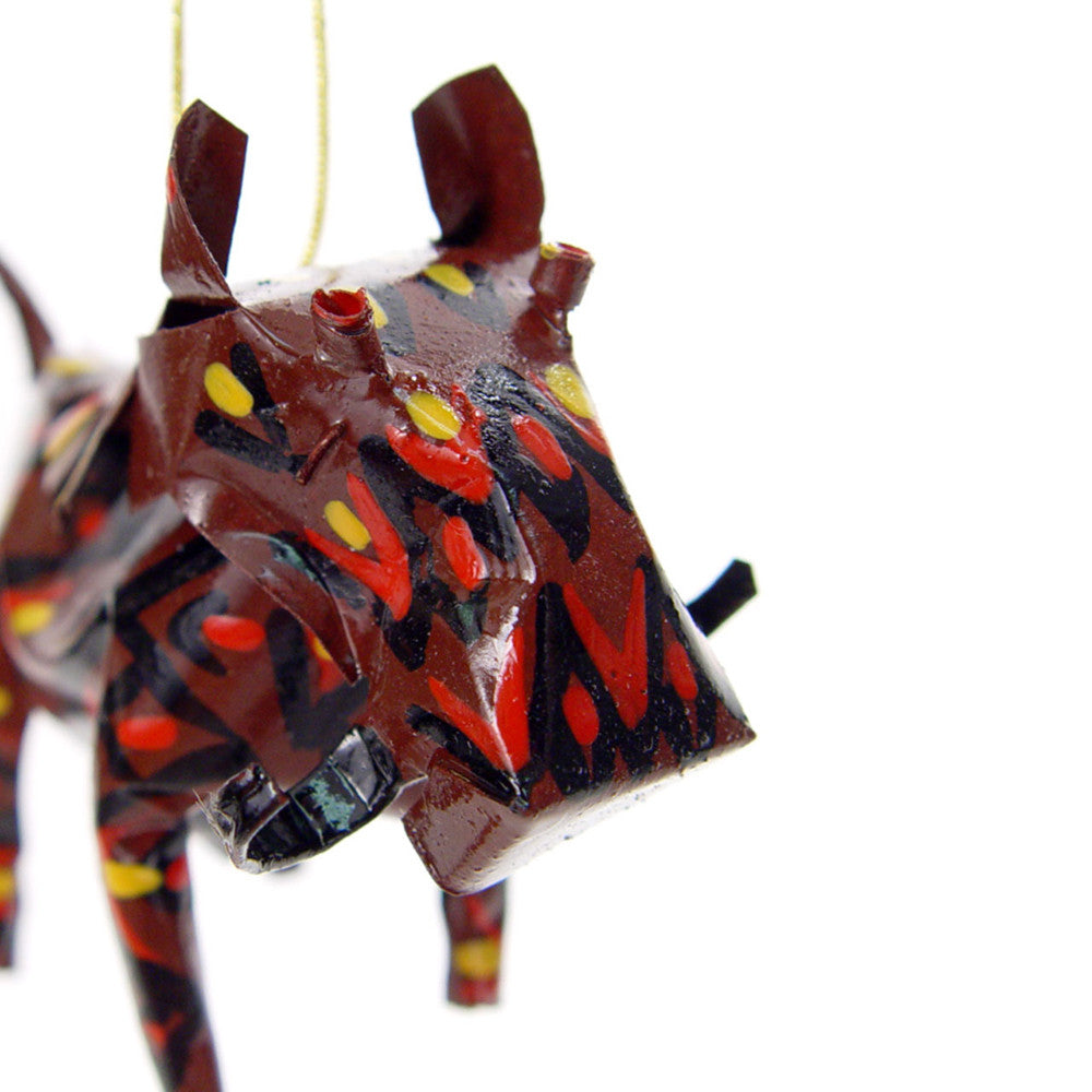 Warthog ornament close-up detail with glossy speckled paint and colorful dot patterns