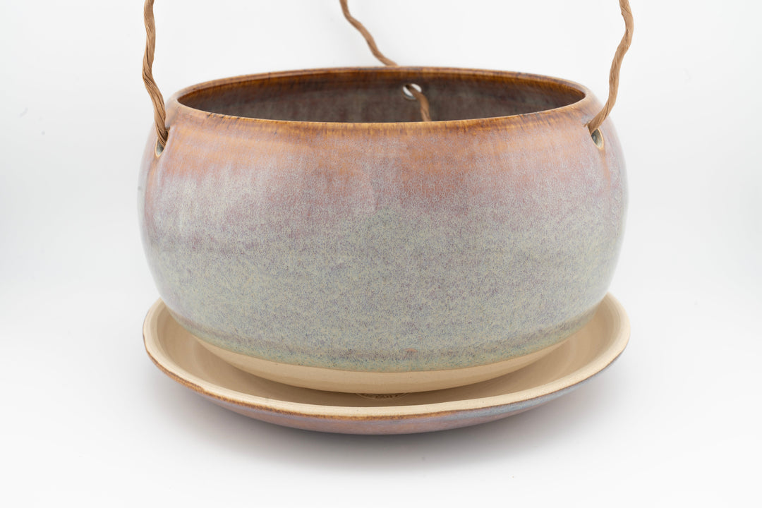 Glazed hanging planter with rope handles and round saucer base, grayish blue