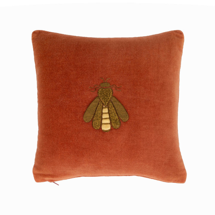Rust orange velvet throw pillow cover with embroidered bee design.