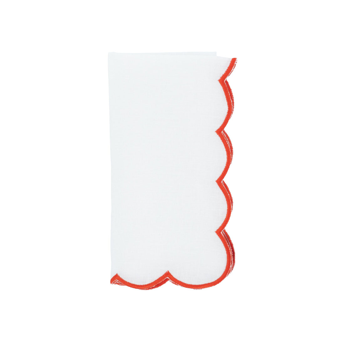 Scalloped linen napkin with red embroidered edge, upright fold view