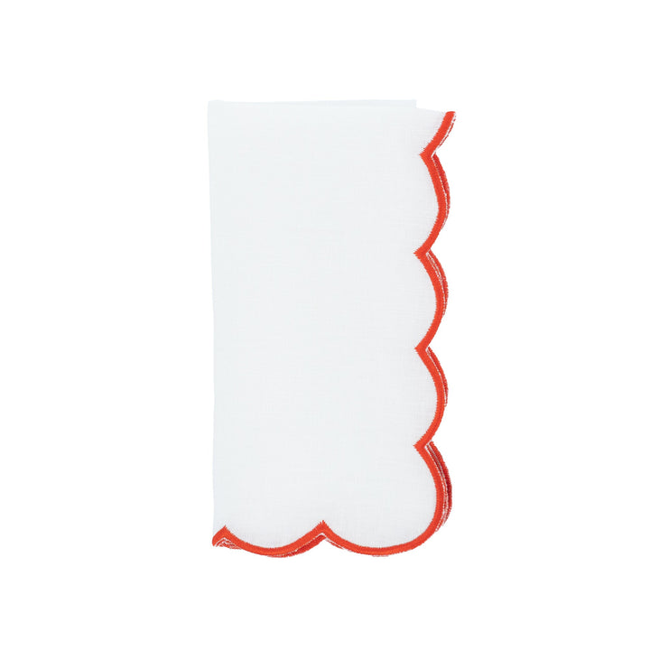 Scalloped linen napkin with red embroidered edge, upright fold view