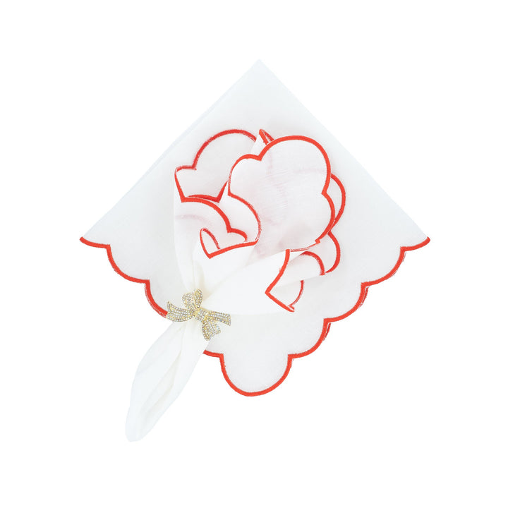Scalloped linen napkins with red edge trim, heart applique and gold bow