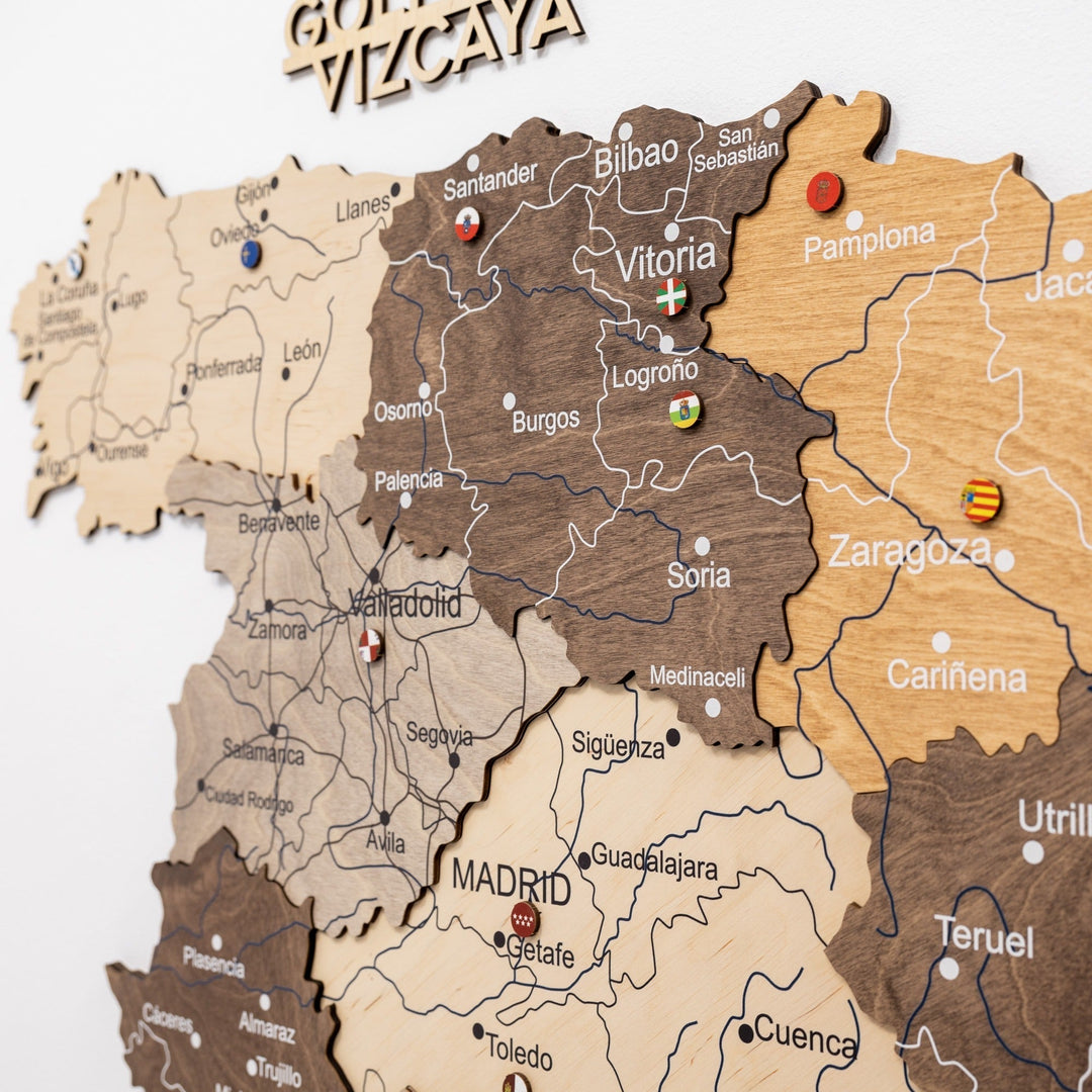 Wooden Spain wall map with city names and colorful flag markers