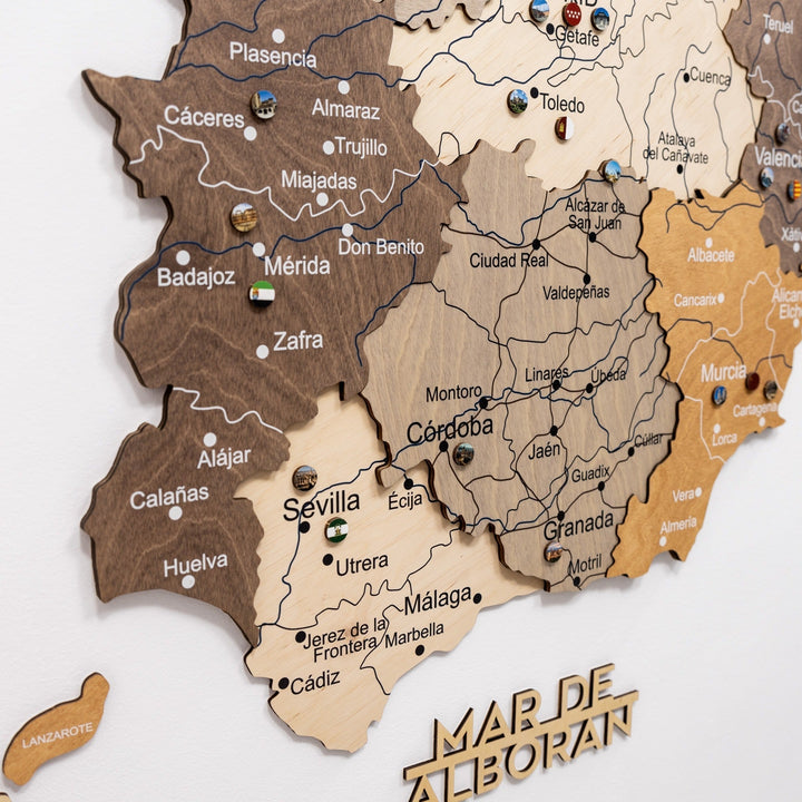 Wooden Spain wall map close-up with route lines and raised city markers