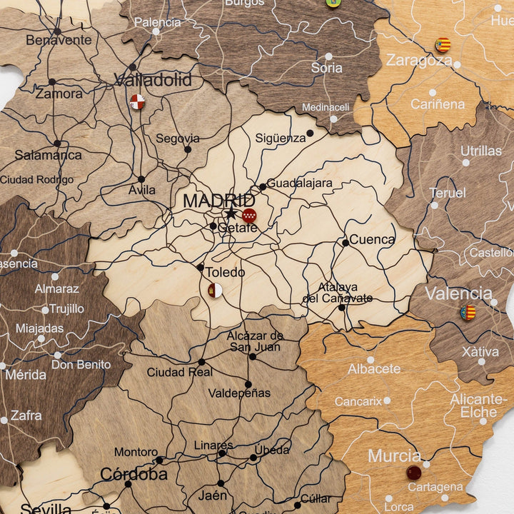 Wooden Spain map with painted borders and multicolor region highlights
