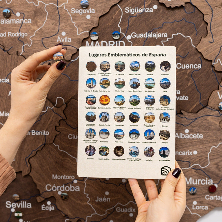 Dark walnut wooden Spain map with pins and landmark guide card