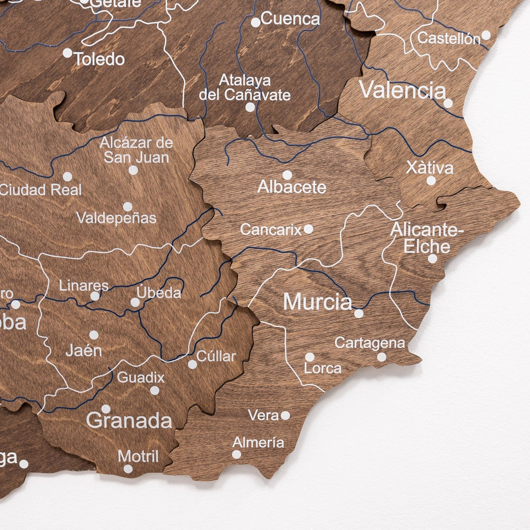 Dark walnut wooden Spain map close-up with Valencia and Murcia labels