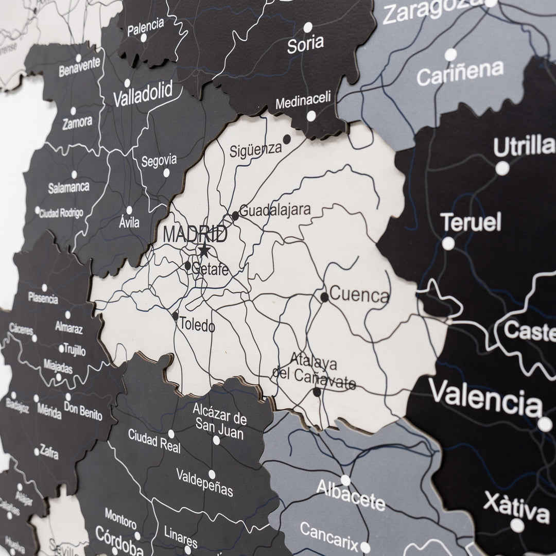 Wooden Spain map close-up showing Madrid, Valencia, and surrounding city labels