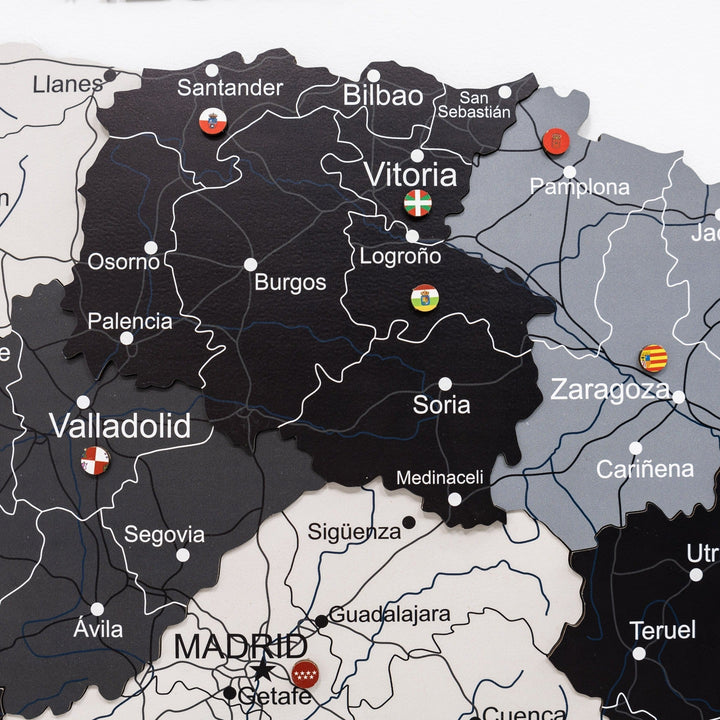 Wooden Spain map detail with highlighted regions, town labels, and marker dots