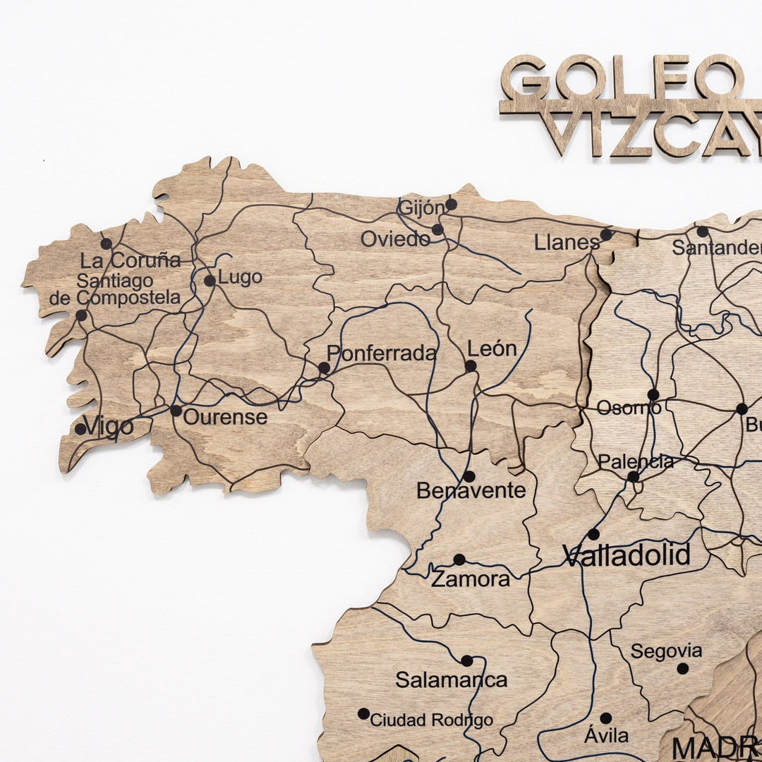 Wooden Spain map panel with carved coast outlines, region lines, and town names