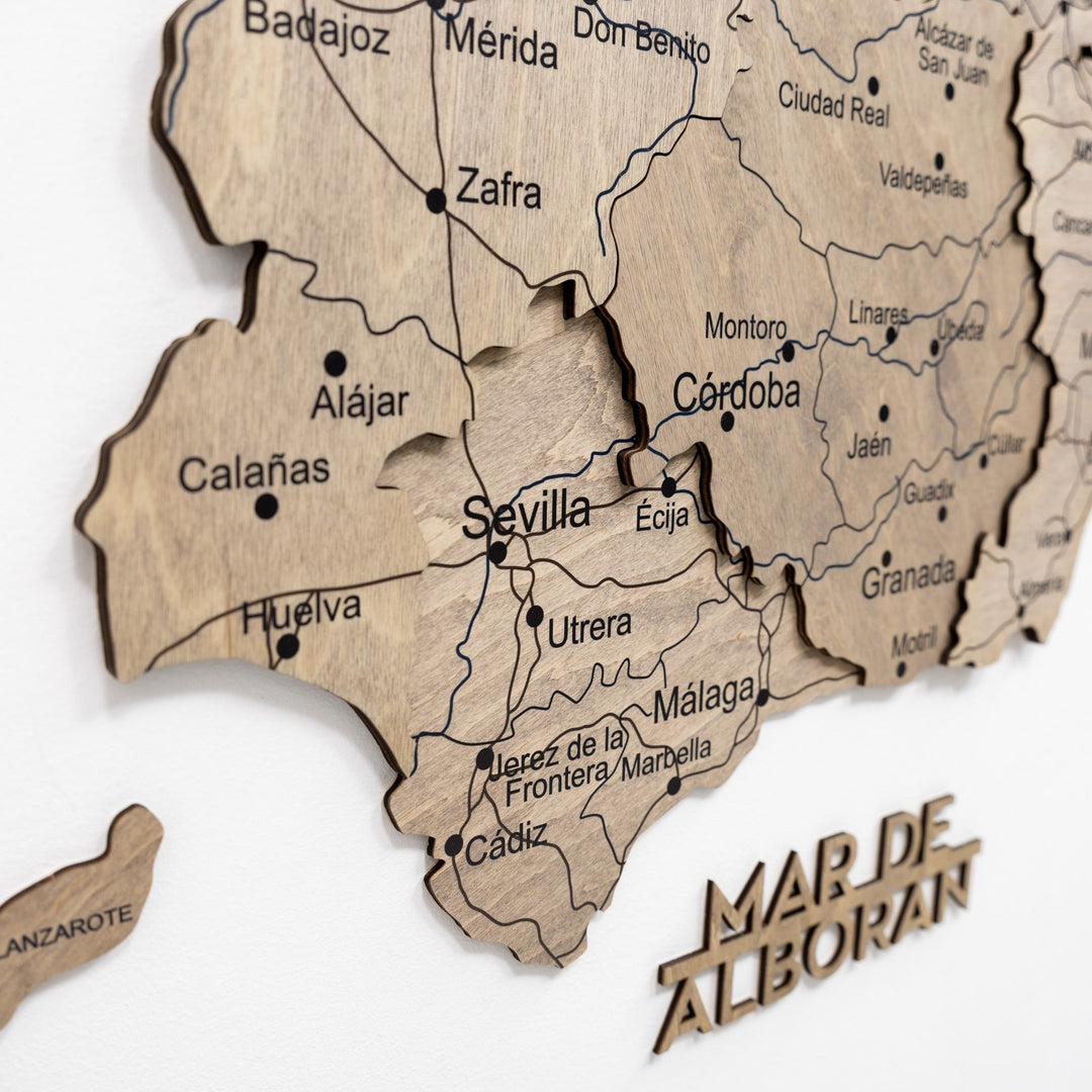 Wooden Spain map wall decor section with engraved region borders and city labels