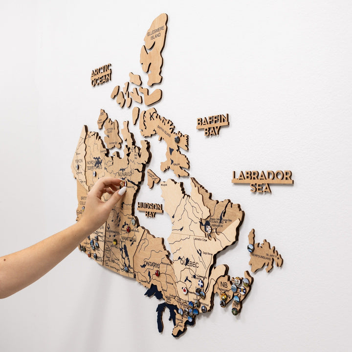 Wooden 3D Canada wall map with Labrador Sea and Baffin Bay labels and small pins